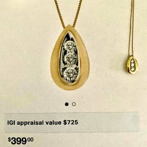 14K Gold teardrop pendant with 3 diamonds.